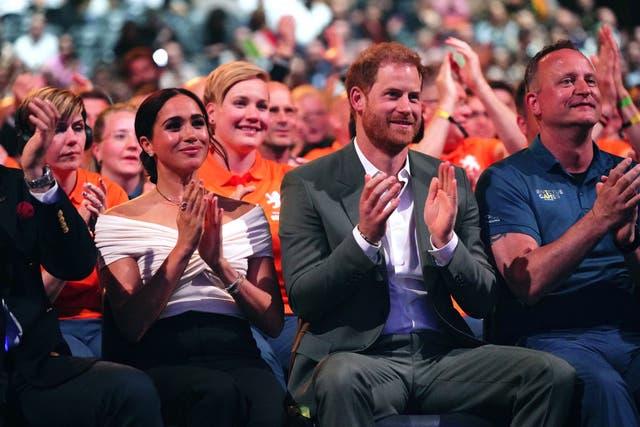 The Duke and Duchess of Sussex watch the Invictus Games opening ceremony at the Hague, Netherlands in 2022 (Aaron Chown/PA)