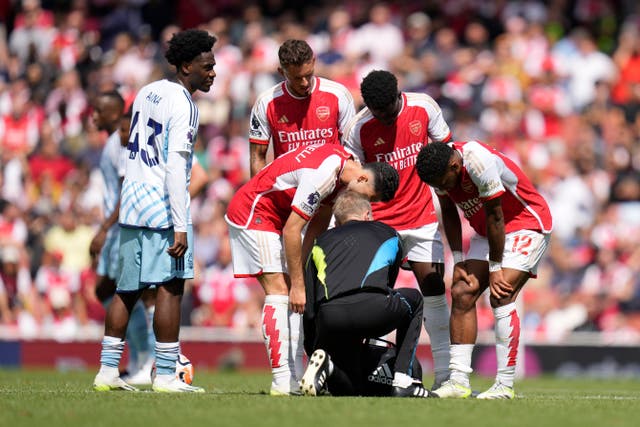 Jurrien Timber, right, has suffered a serious injury (Kirsty Wigglesworth/AP)
