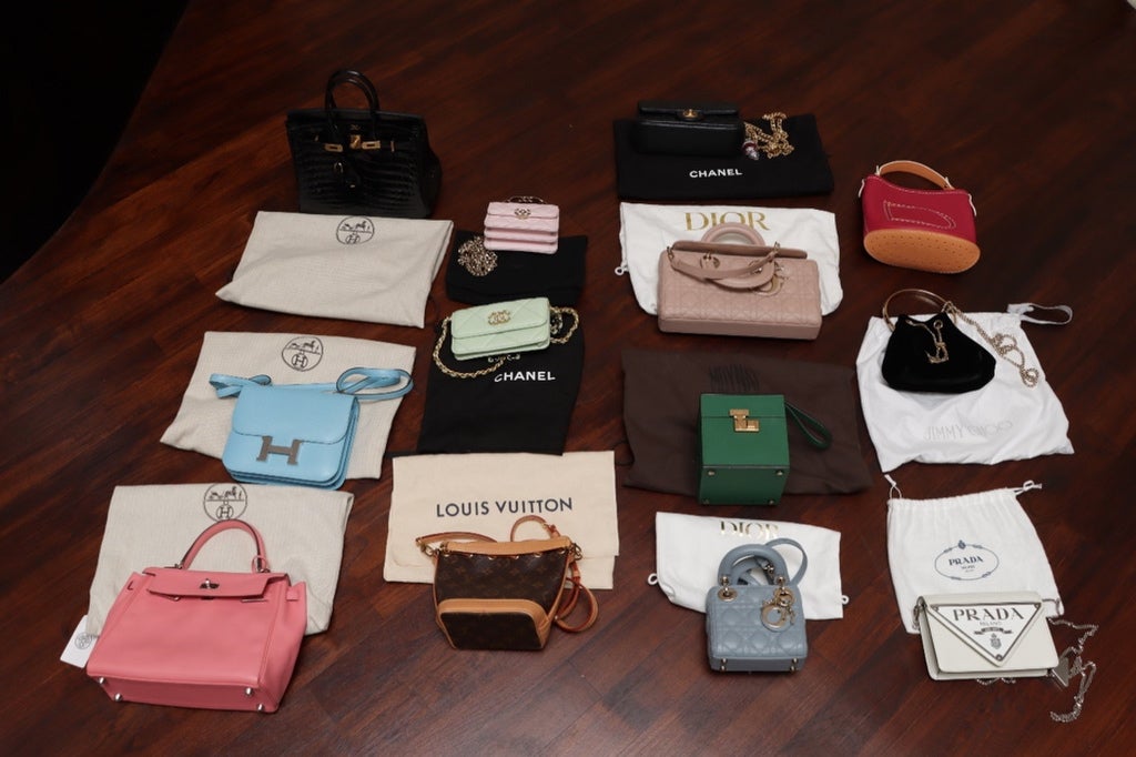 An undated handout photo released by the Singapore Police Force shows luxury handbags seized during an anti-money laundering raid in Singapore
