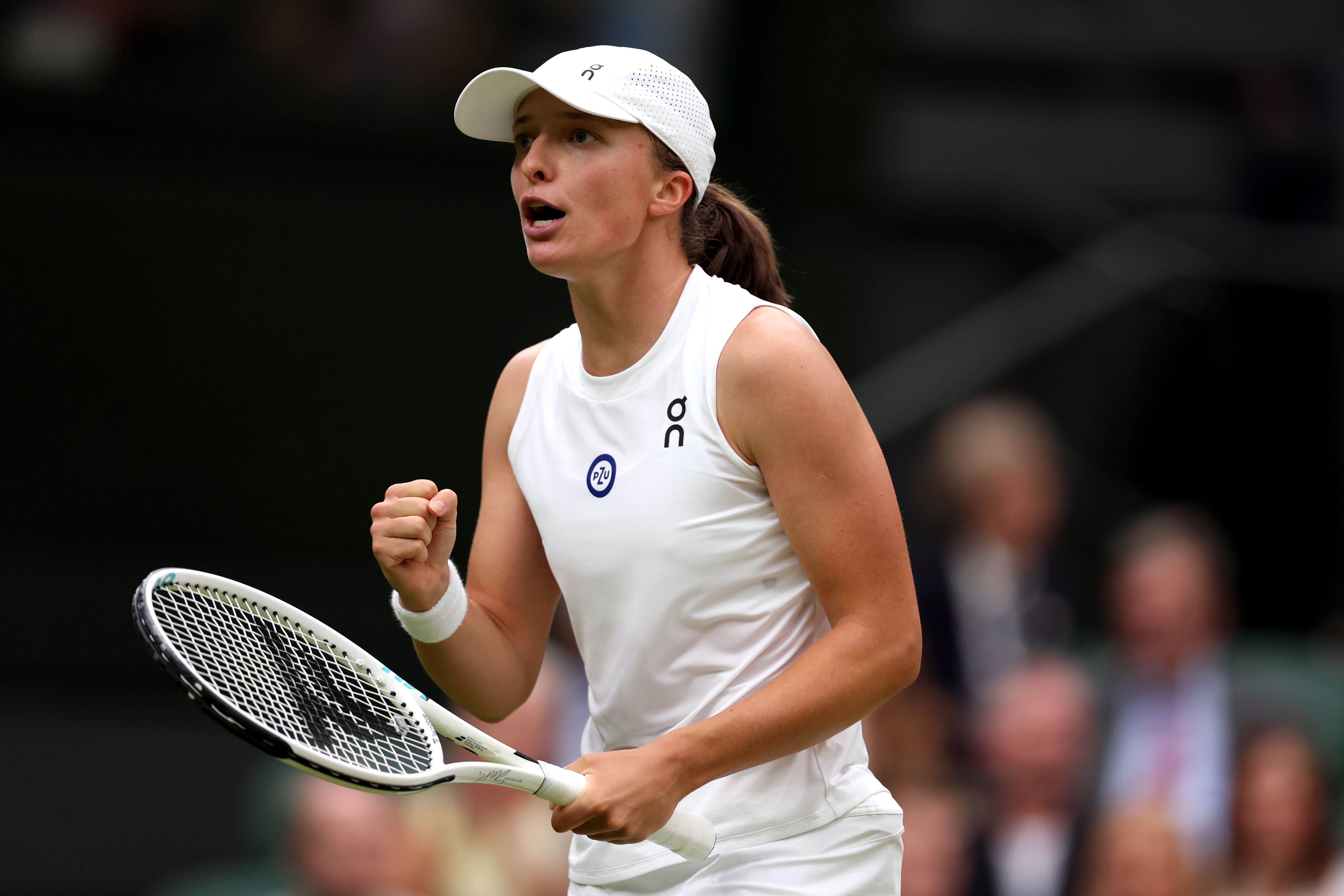 Iga Swiatek came from a set down to reach the quarter-finals (Steven Paston/PA)