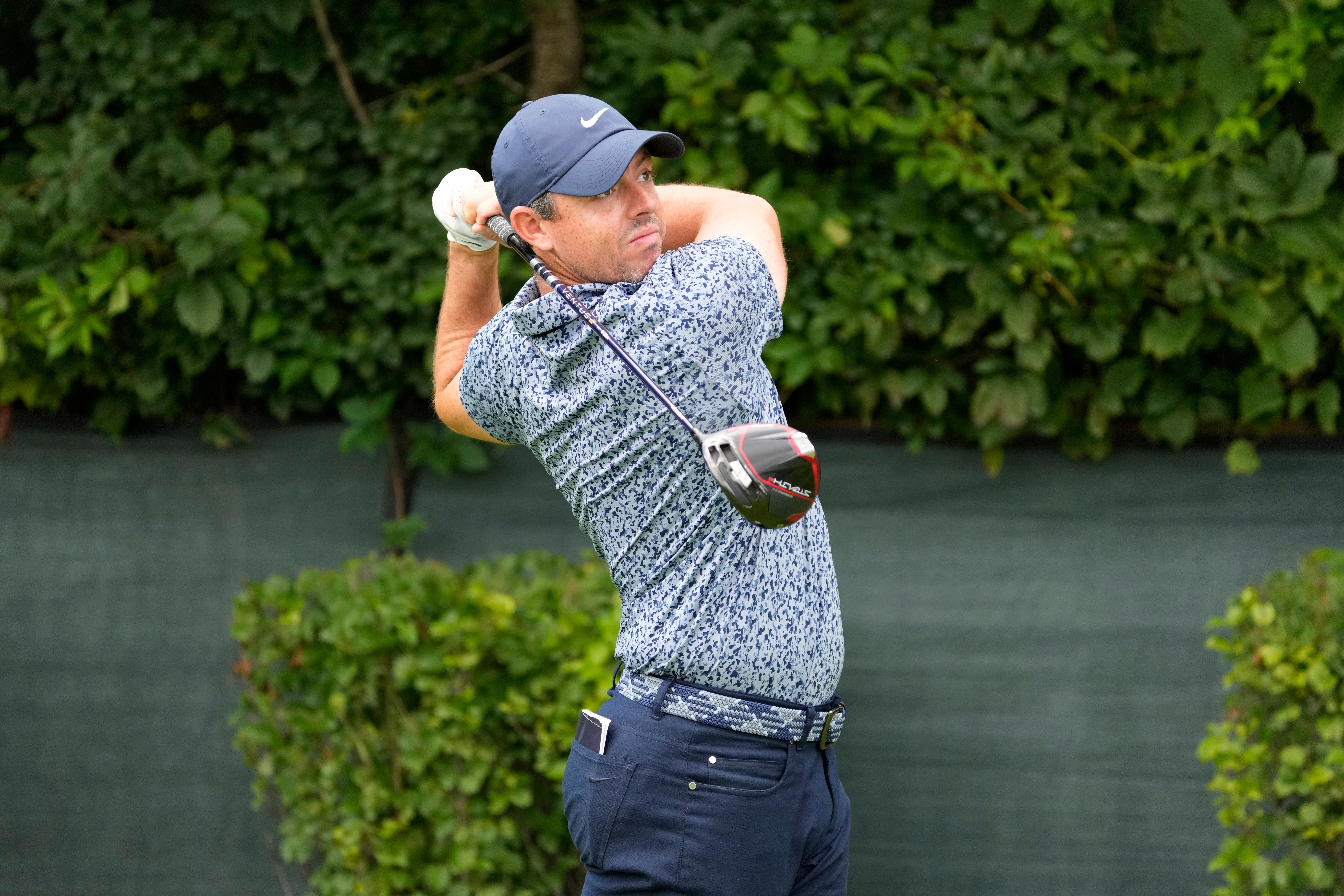 Rory McIlroy watches his tee shot on the second hole during the first round of the BMW Championship (Charles Rex Arbogast/AP)