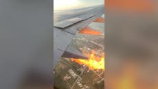 Plane passenger films flames shooting out of wing mid-flight