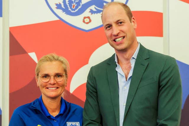 <p>Prince William, Prince of Wales and President of The Football Association, gives an honorary CBE to England manager Sarina Wiegman during a visit to England Women's team to wish them luck ahead of the 2023 FIFA Women's World Cup at St Georges Park on June 20, 2023</p>