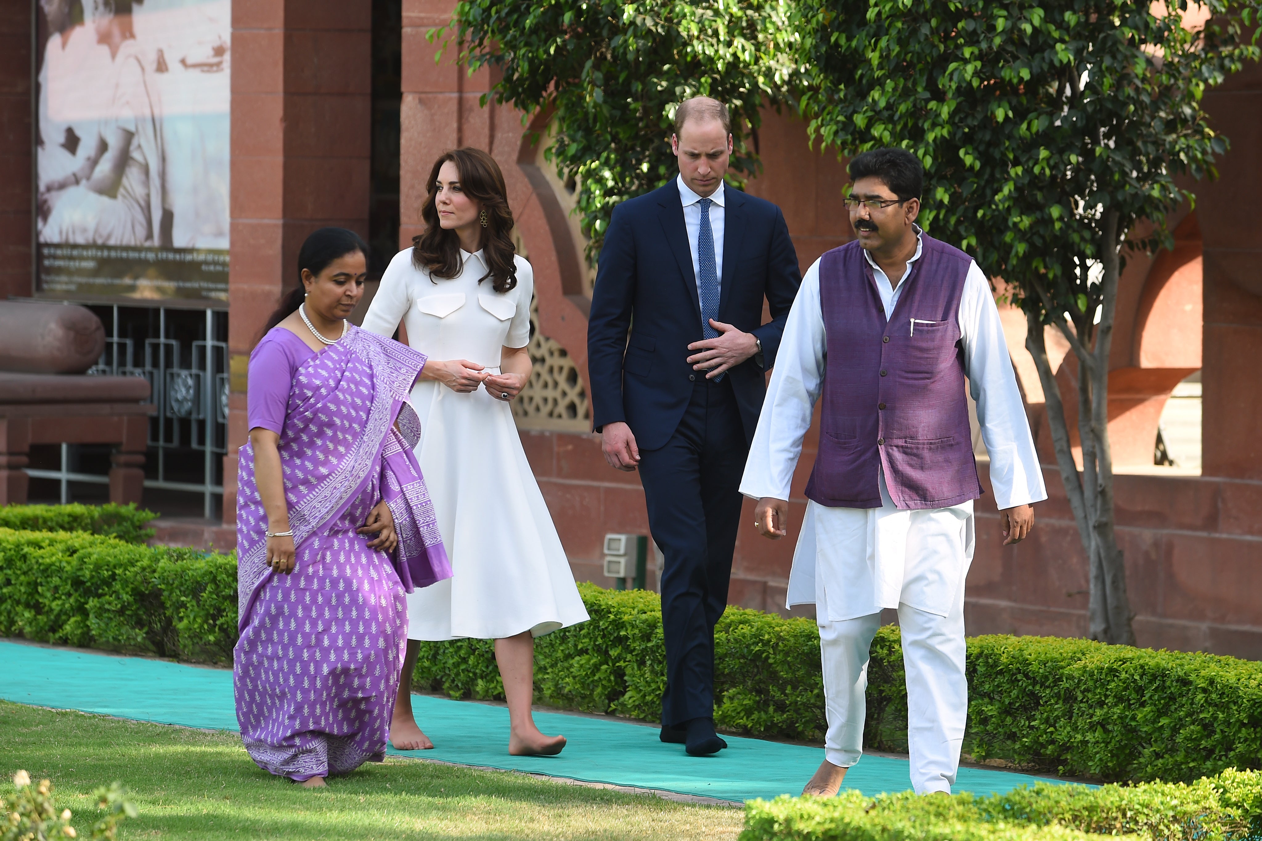 Catherine, Duchess of Cambridge and Prince William, Duke of Cambridge walk barefoot paying their respects at Gandhi Smriti, a museum located in Old Birla House, where Mahatma Gandhi, India's founding father, spent the last few years of his life, on April 11, 2016