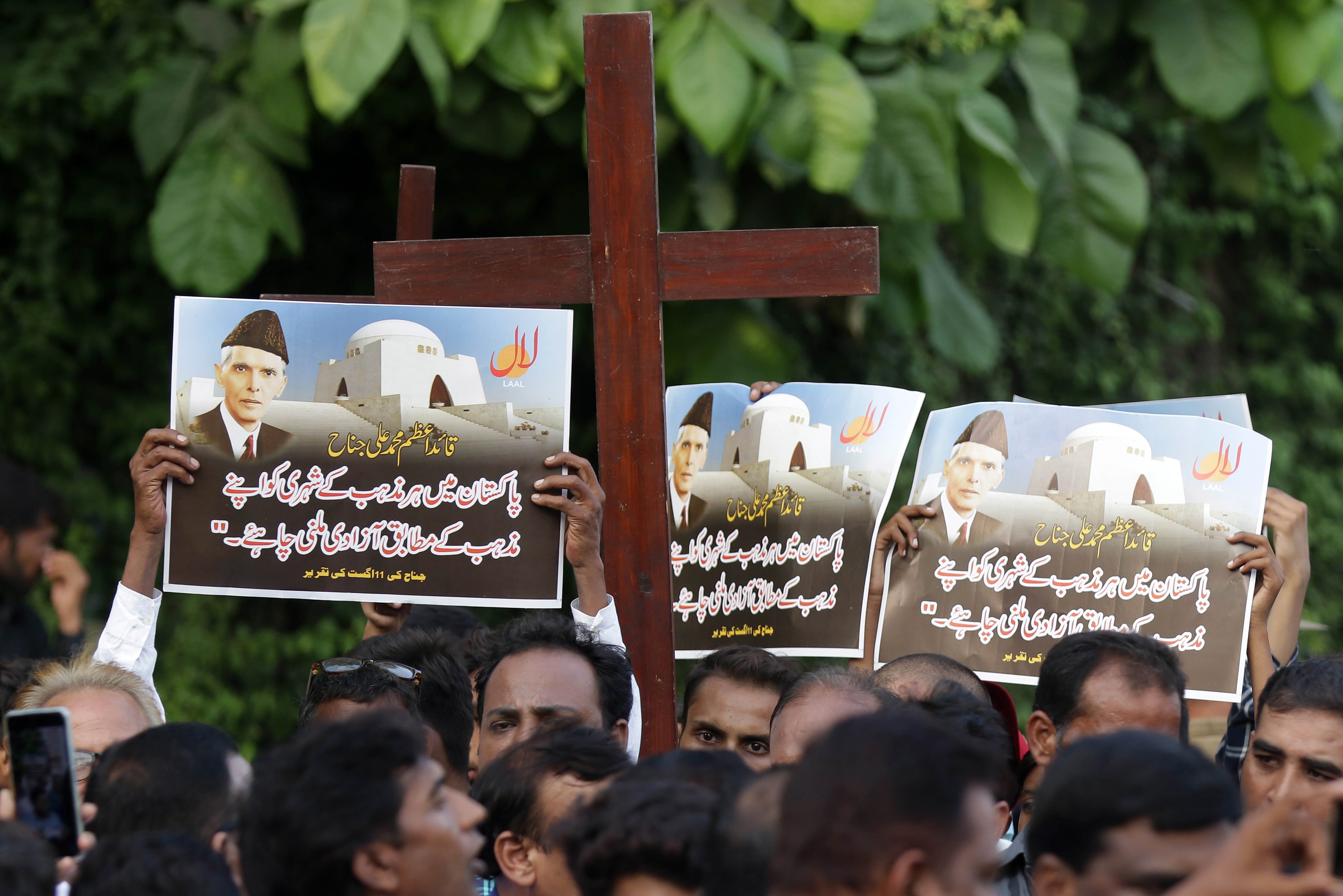 <p>Members of the Christian minority protest against sectarian violence</p>