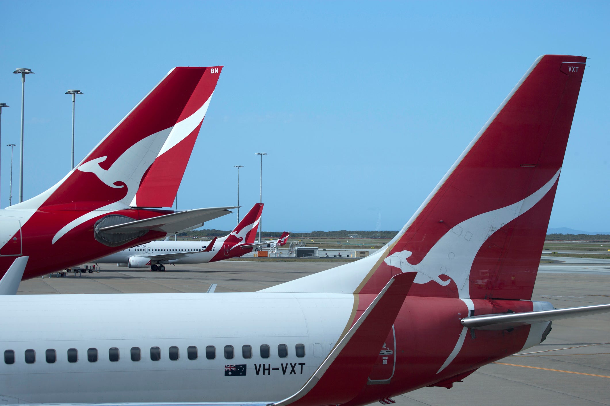 <p>Qantas planes seen at Brisbane airport in 2014 </p>