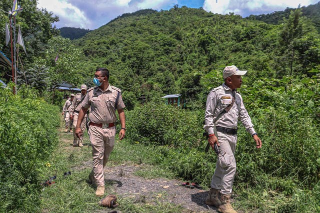 <p>Manipur Police and Gurkha Regiment personnel patrol in the periphery of Imphal East area in India’s north-eastern Manipur state during ongoing ethnic violence</p>