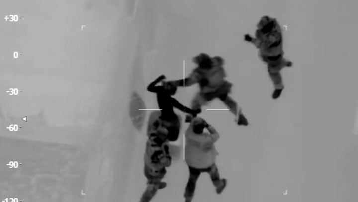 <p>Armed police surround suspect hiding in a wheelie bin.</p>