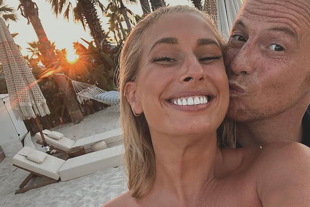 <p>Too much? Stacey Solomon is given a peck on the cheek by her husband Joe Swash during a luxury holiday documented on her Instagram</p>