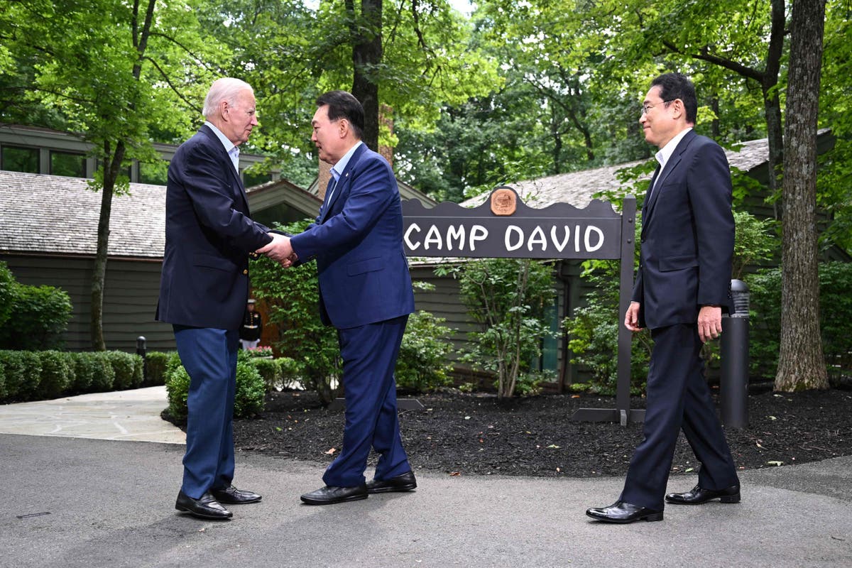 iden says ‘world is safer’ as he meets with Japanese and South Korean leaders at Camp David