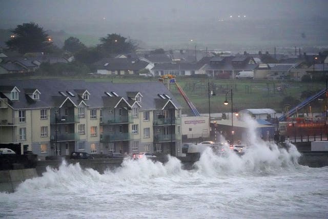 Waves crash against the sea wall in Tramore, Co Waterford (Niall Carson/PA)