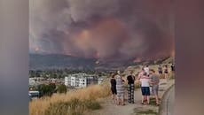 Terrified onlookers watch as wildfire smoke engulfs British Columbia sky