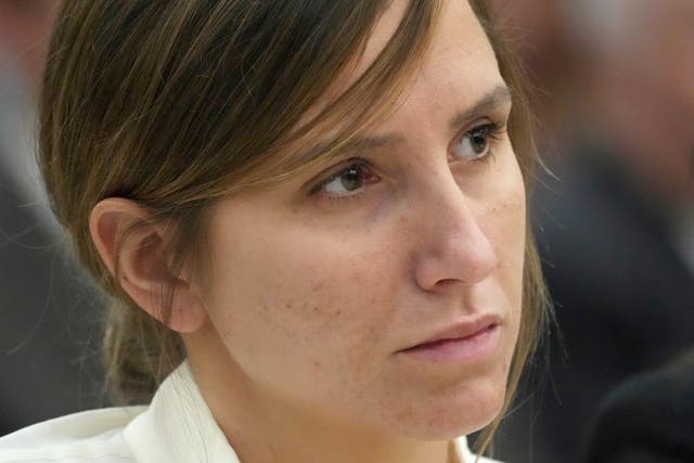 <p>Kouri Richins, a Utah mother of three, who authorities say fatally poisoned her husband, Eric Richins, then wrote a children's book about grieving, looks on during a bail hearing, June 12, 2023, in Park City</p>
