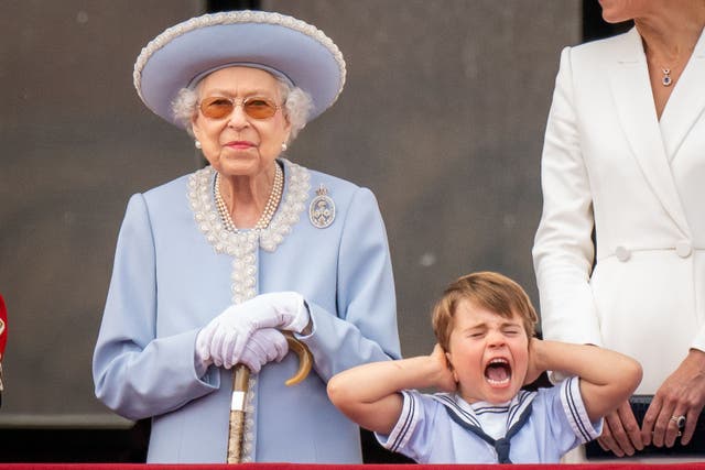 The late Queen and Prince Louis on the balcony of Buckingham Palace (Aaron Chown/PA)