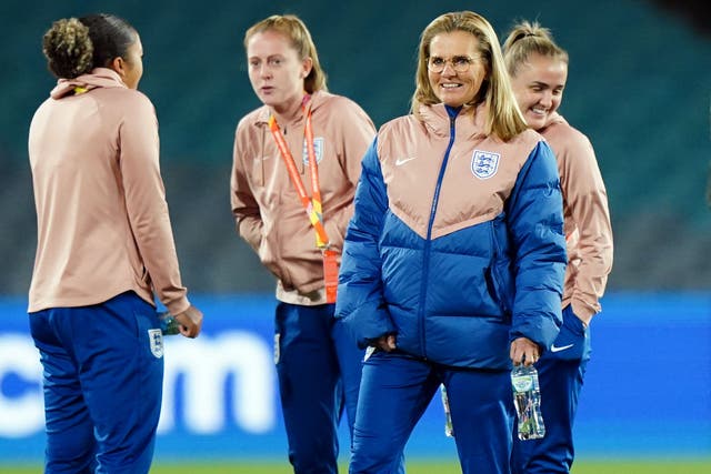 England head coach Sarina Wiegman (second from right) and players on the pitch at Stadium Australia in Sydney ahead of Sunday’s World Cup final against Spain (Zac Goodwin/PA).