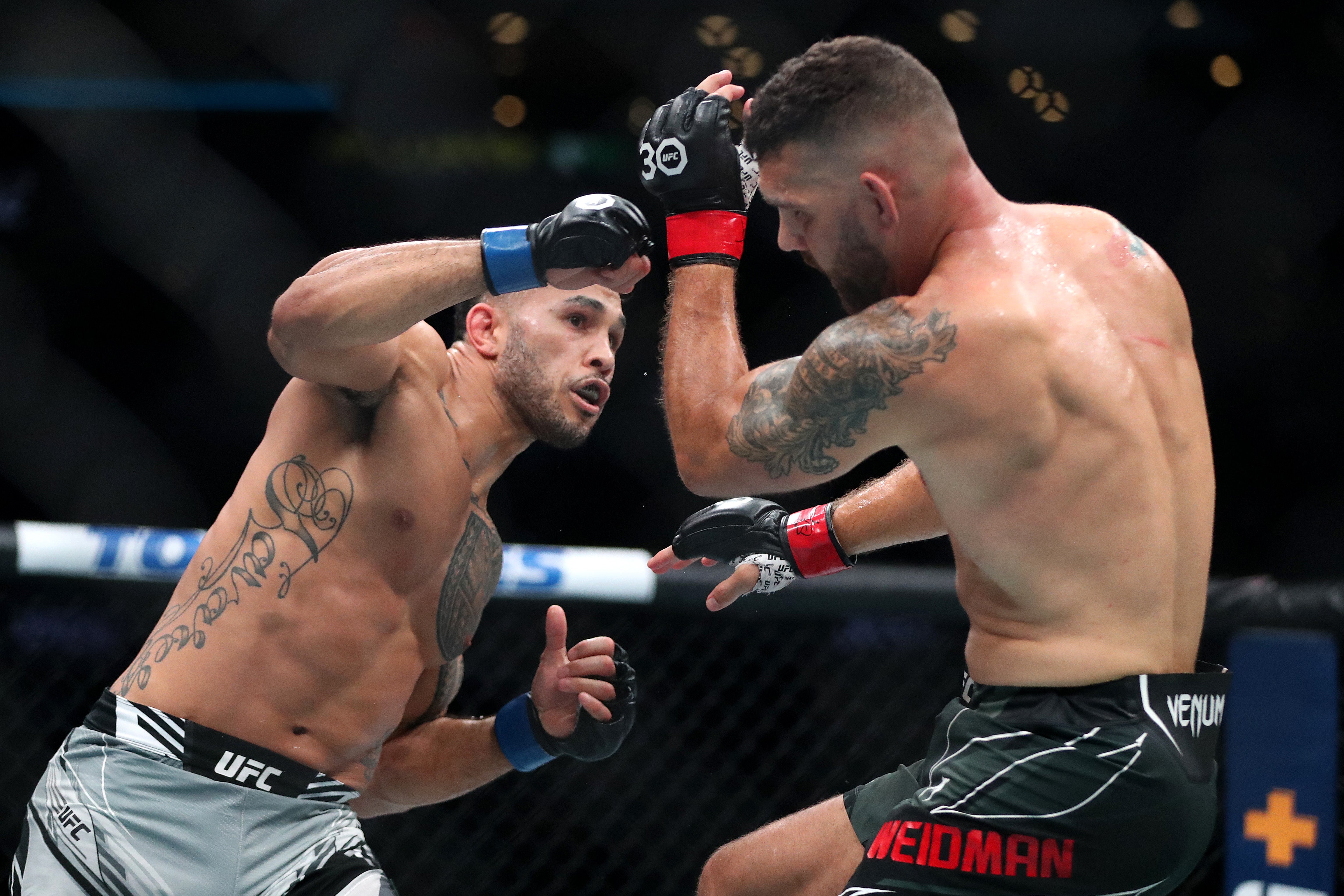 Brad Tavares, left, beat Chris Weidman, who returned after a two-year absence caused by a broken leg