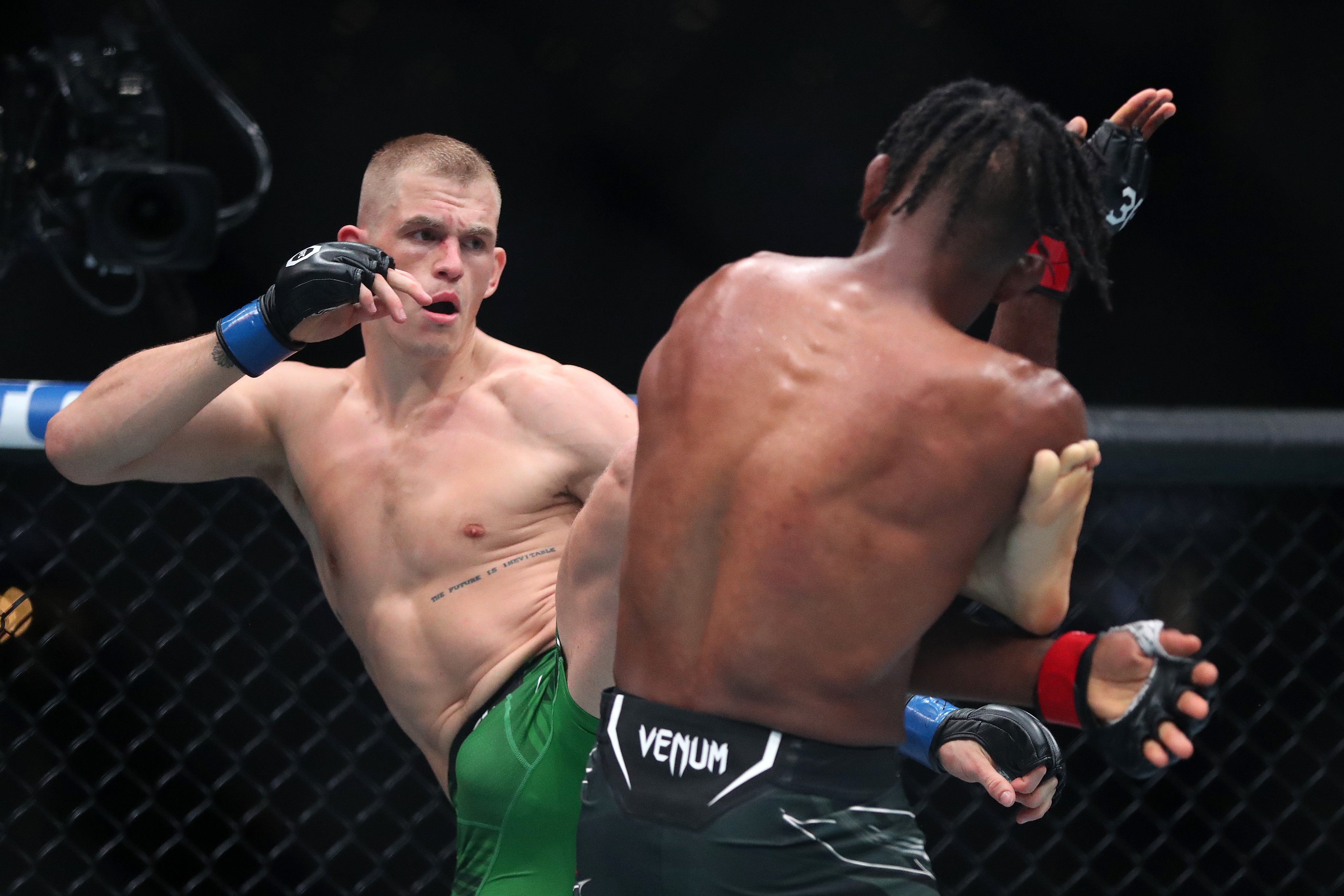 Ian Machado Garry, left, outclassed Neil Magny to ease to a decision win