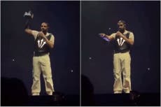 Drake issues warning after fan throws book at his head on stage: ‘You’re lucky I’m quick’