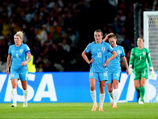 <p>England players look dejected after Spain’s Olga Carmona scores the only goal of the match </p>