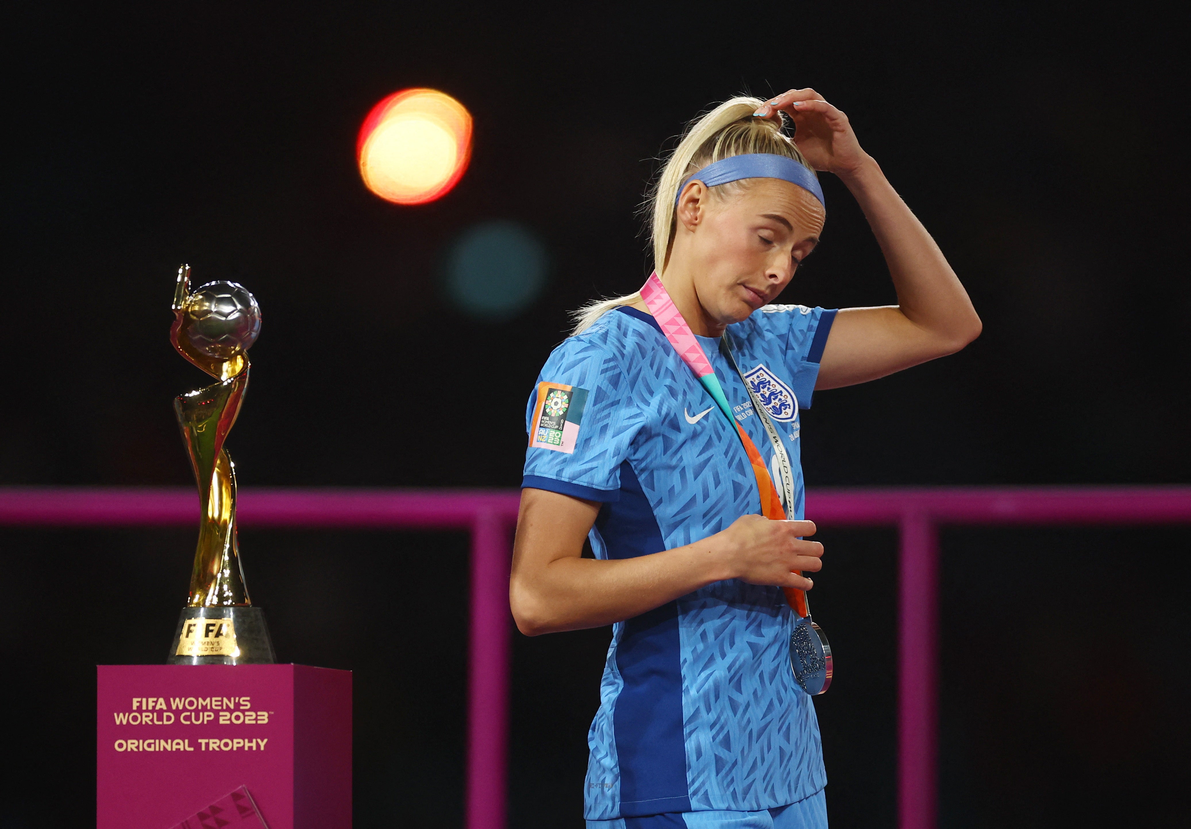 England’s Chloe Kelly walks past the trophy