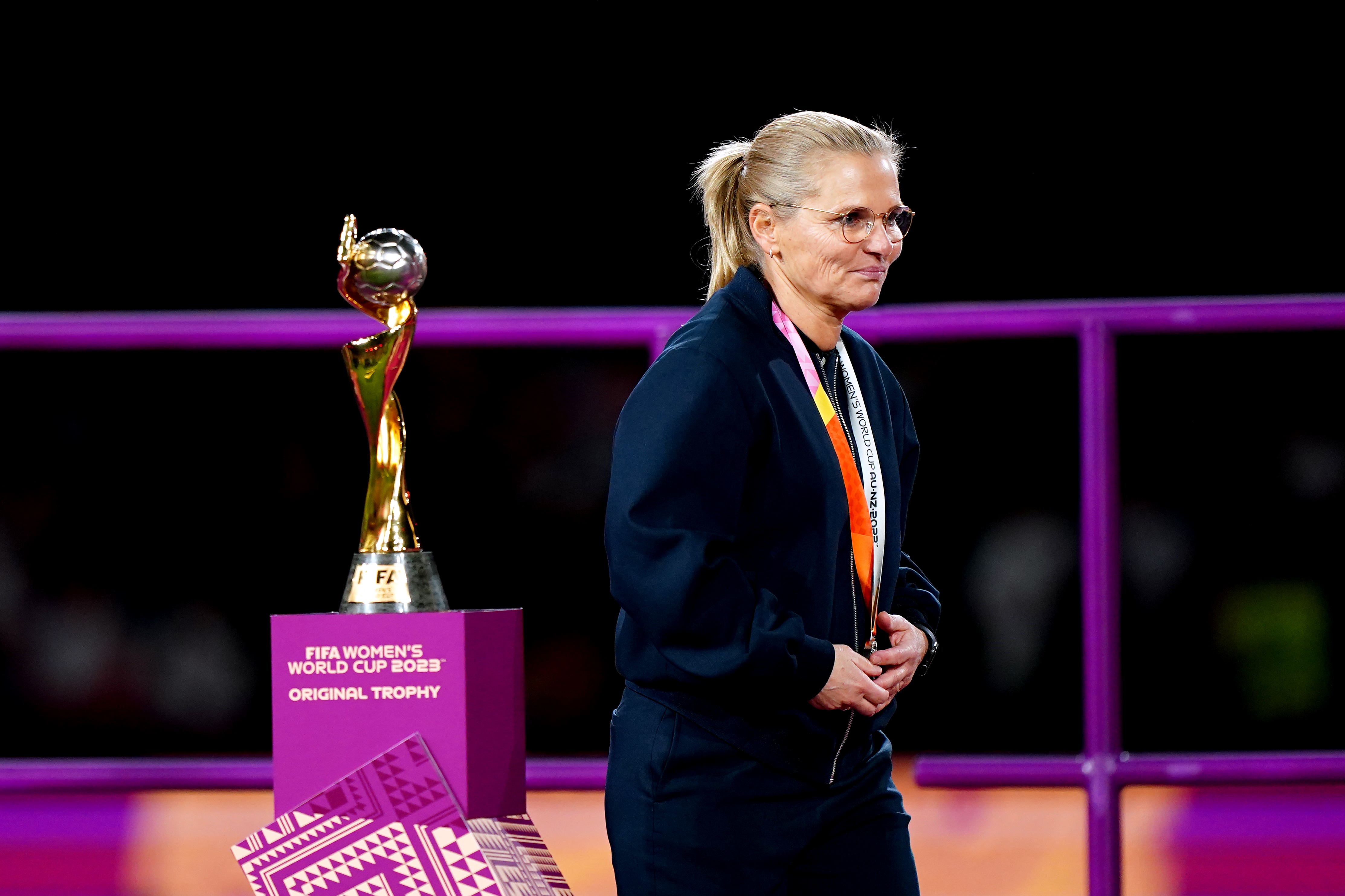 England head coach Sarina Wiegman walks past the Fifa Women’s World Cup trophy