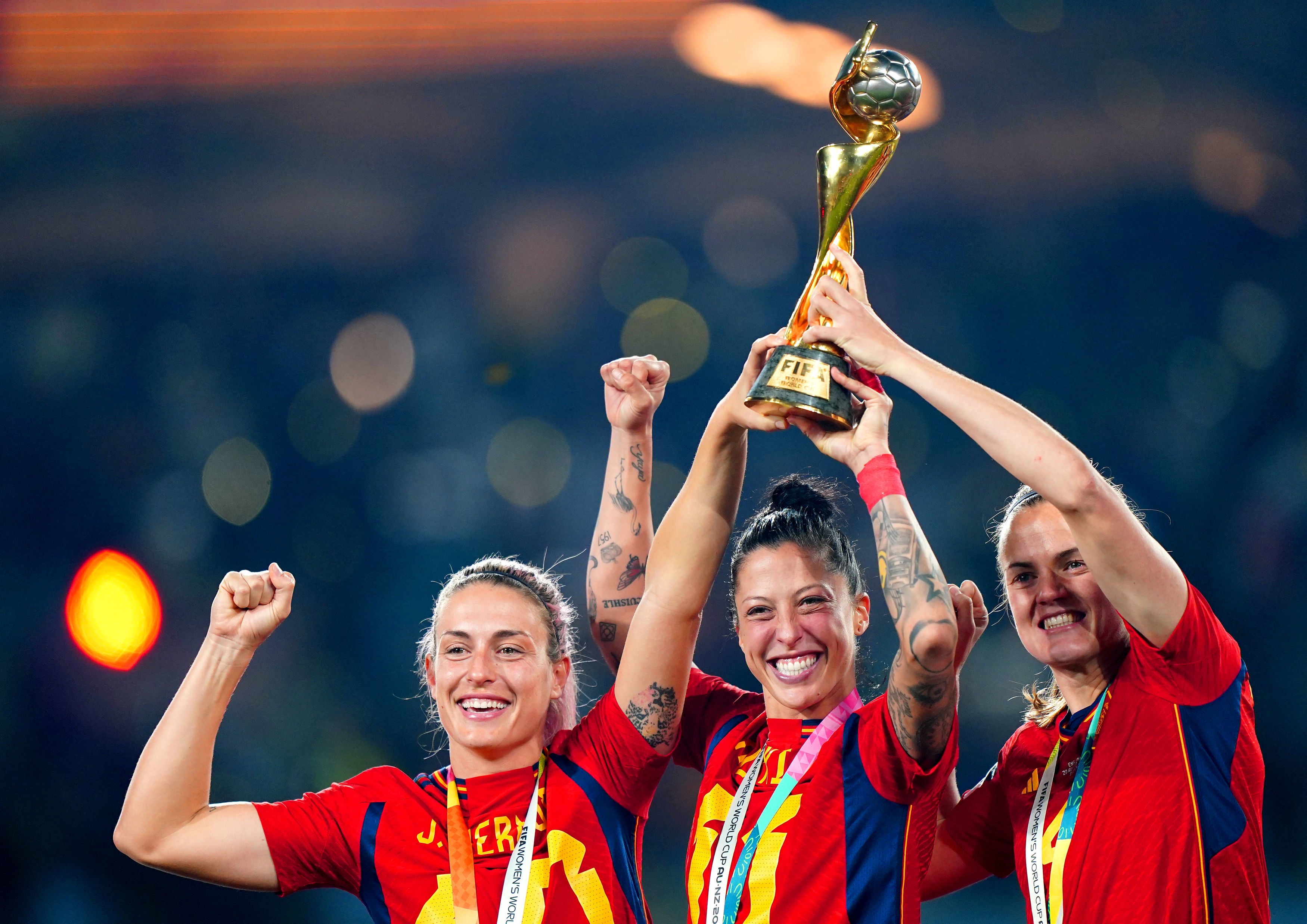 Spain's Alexia Putellas (left), Jennifer Hermoso and Irene Paredes celebrate with the trophy