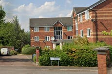 Manhunt after masked gang storm flat and stab family in ‘unprovoked attack’