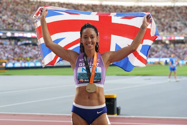 Great Britain’s Katarina Johnson-Thompson poses with her gold medal after winning the Women’s Heptathlon on day two of the World Athletics Championships in Budapest (Martin Rickett/PA)