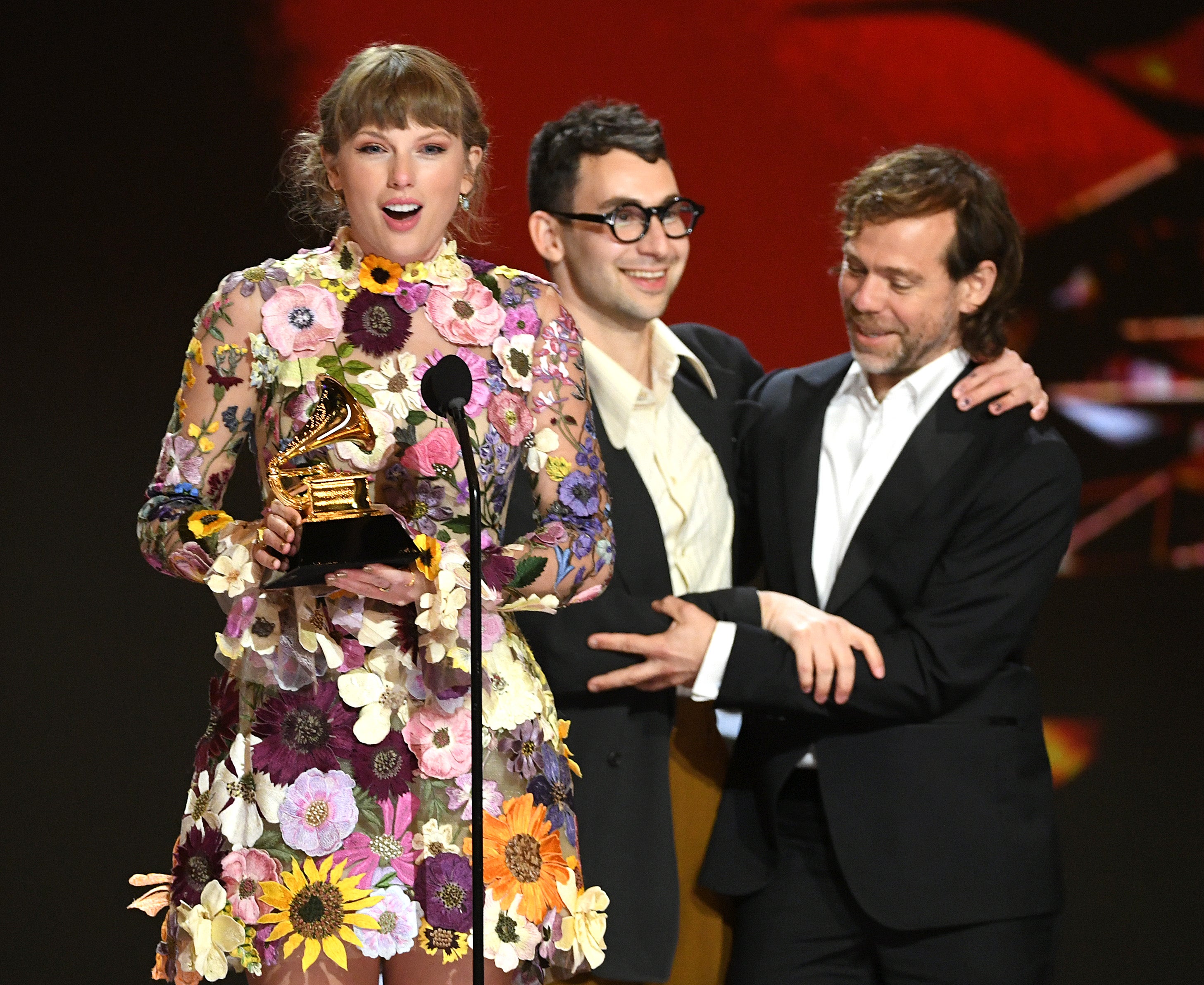Taylor Swift, Jack Antonoff, and Aaron Dessner accept the Album of the Year award for ‘Folklore’ onstage during the 2021 Grammy Awards
