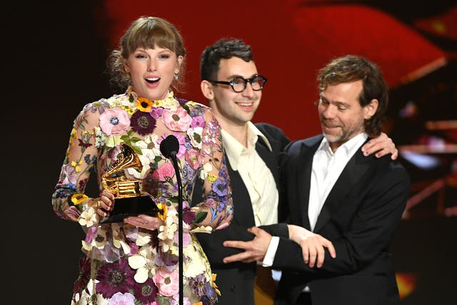<p> Taylor Swift, Jack Antonoff, and Aaron Dessner accept Album of the Year award for Folklore onstage during 63rd Annual GRAMMY Awards at Los Angeles Convention Center on 14 March 2021</p>