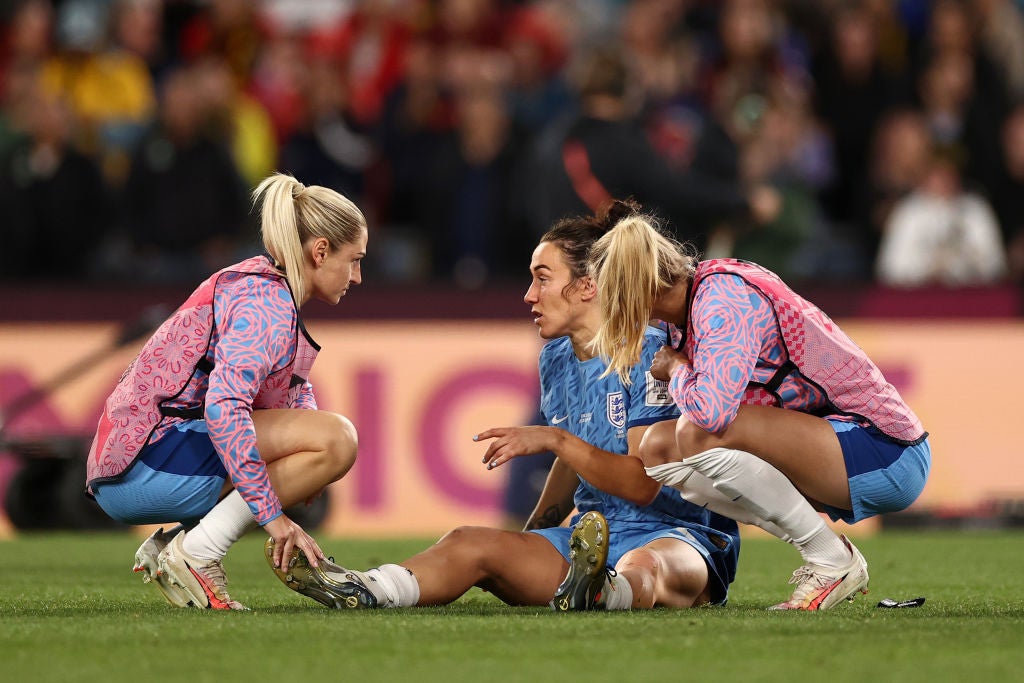 Lucy Bronze is consoled after the World Cup slipped away