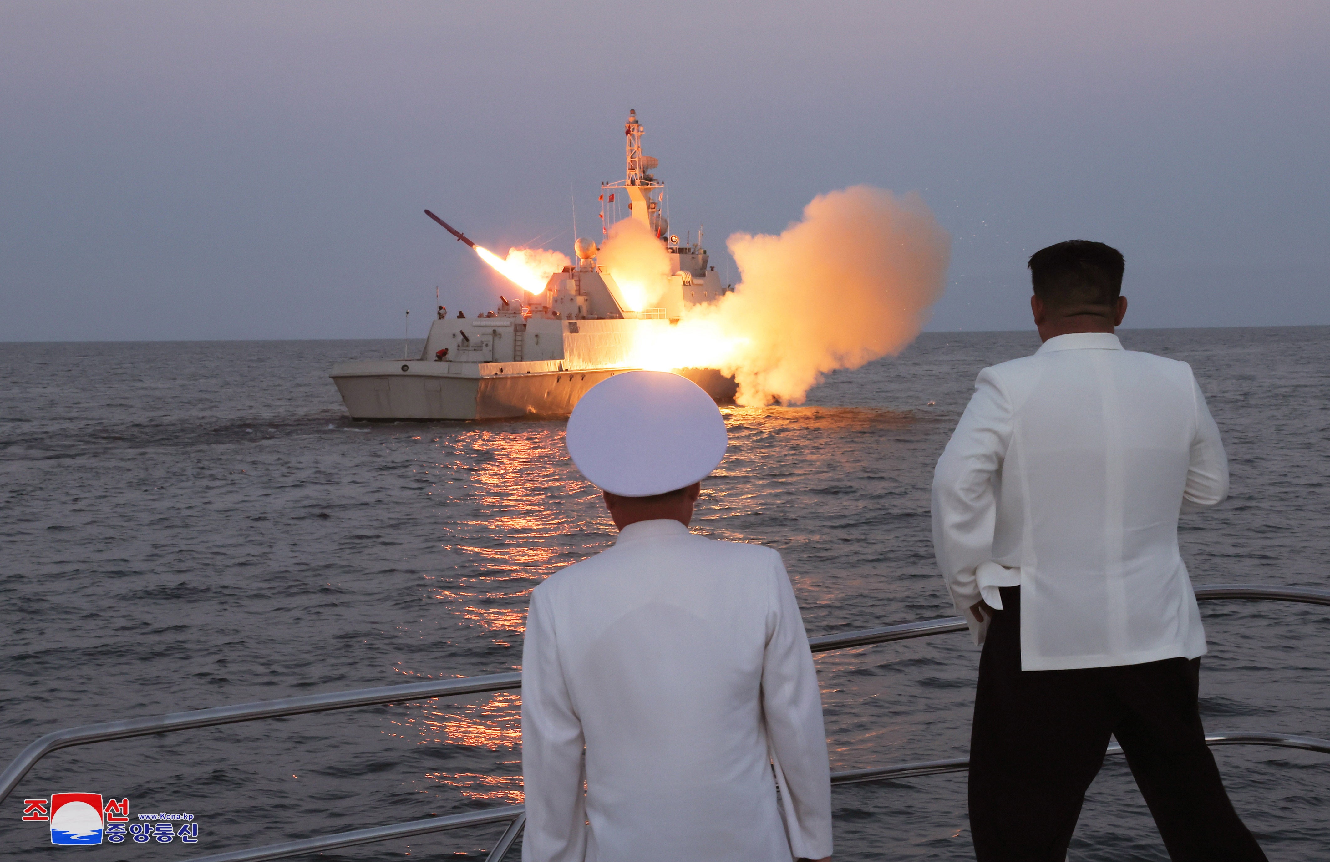 An undated photo released by the official North Korean Central News Agency (KCNA) on 21 August 2023 shows North Korean leader Kim Jong Un (R) inspecting a flotilla of the East Sea Fleet of the Navy of the Korean People’s Army (KPA) in North Korea
