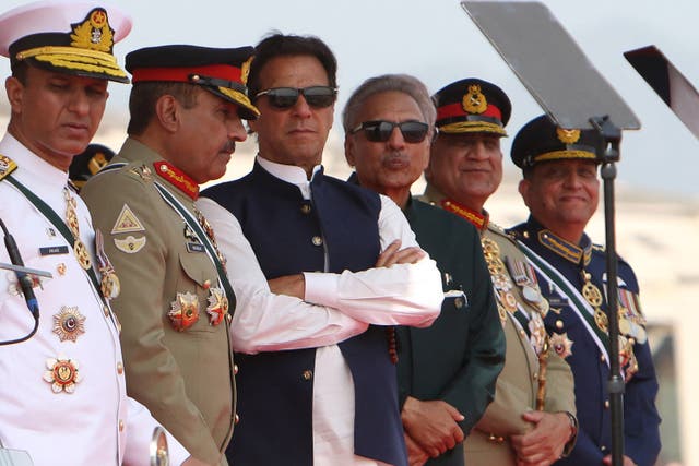 <p>File: Pakistan’s former prime minister Imran Khan (3L) and president Arif Alvi (3R) watch Pakistan’s Air Force fighter jets perform during the Pakistan Day parade in Islamabad</p>