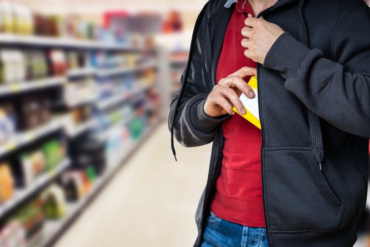 A would-be shoplifter conceals an item under his jacket