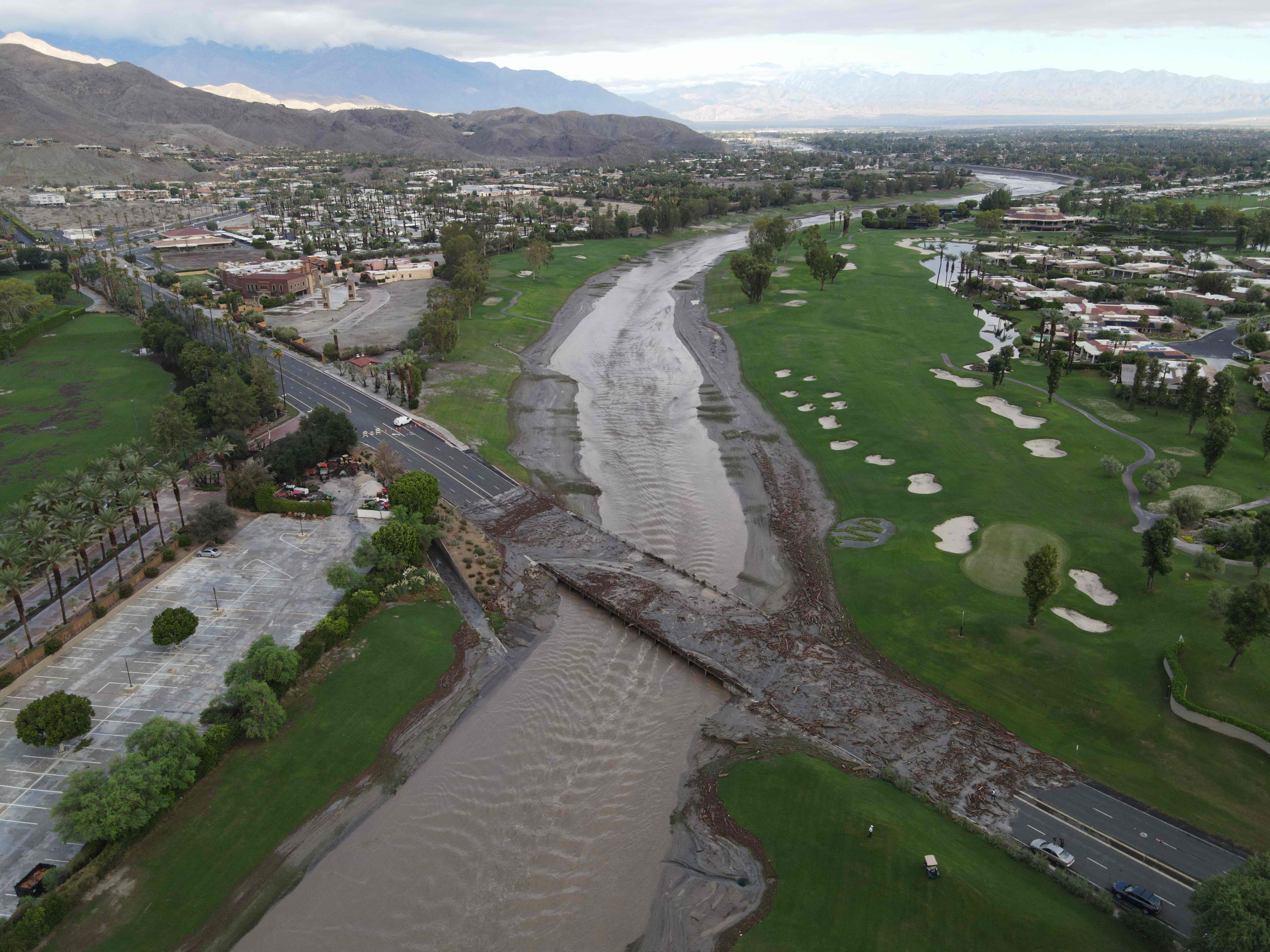 An aerial image shows debris following heavy rains from Tropical Storm Hilary, at Thurderbird Country Club in Rancho Mirage, California, on August 21, 2023