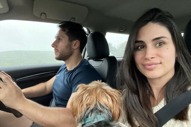 Tim Amoui and his partner Shayda Frost driving in the rain (Shayda Frost/PA)