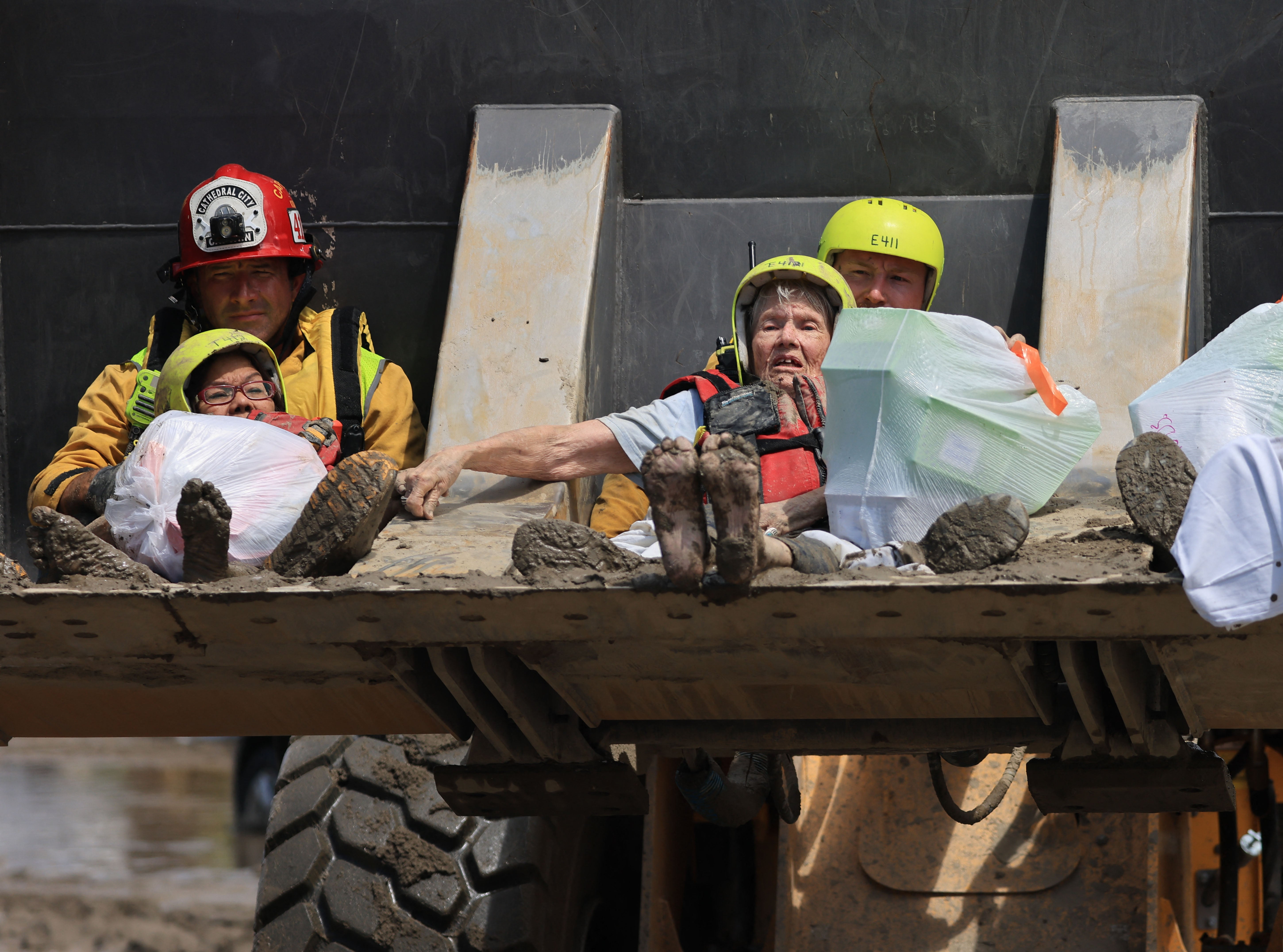 Cathedral city fire department rescues residents in a bulldozer following heavy rains from tropical storm Hilary in Cathedral City, California