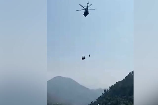 <p>Rescue helicopter battles to save a stricken cable car in Pakistan.</p>
