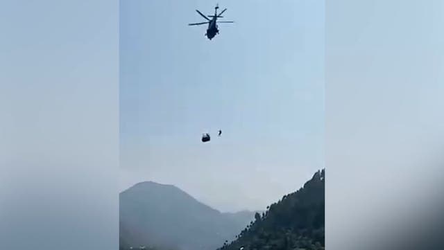 <p>Rescue helicopter battles to save a stricken cable car in Pakistan.</p>