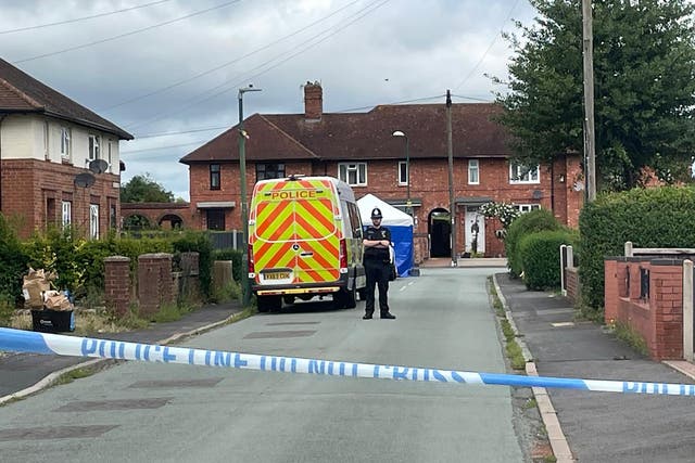 Police at the scene in Berwick Avenue, Coton Hill, near Shrewsbury, where a delivery driver died (Stephanie Wareham/PA)