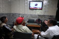 Pakistani rescuers try to free 6 children and 2 men from a cable car hundreds of feet in the air