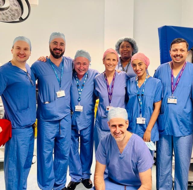 <p>The lead surgeons for Britain’s first womb transplant, including Professor Richard Smith (centre left) and consultant surgeon Isabel Quiroga (centre right)</p>