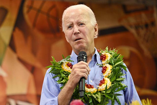 <p>President Joe Biden speaks to survivors of the Maui wildfires on 21 August</p>