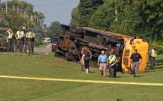 An Ohio school bus overturns after crash with minivan, leaving 1 child dead and 23 injured