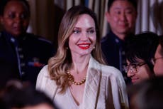 Fans speculate what Angelina Jolie’s new middle finger tattoos may be