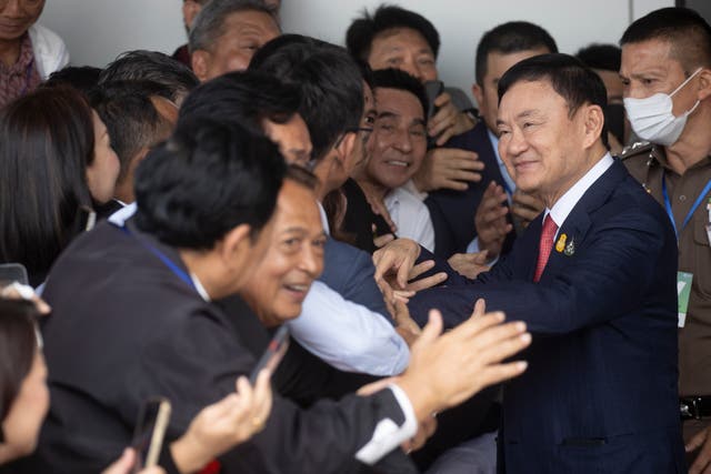 <p>Thailand's former prime minister Thaksin Shinawatra, second right, is greeted by supporters on his arrival at Don Muang airport in Bangkok, Thailand on 22 August 2023</p>