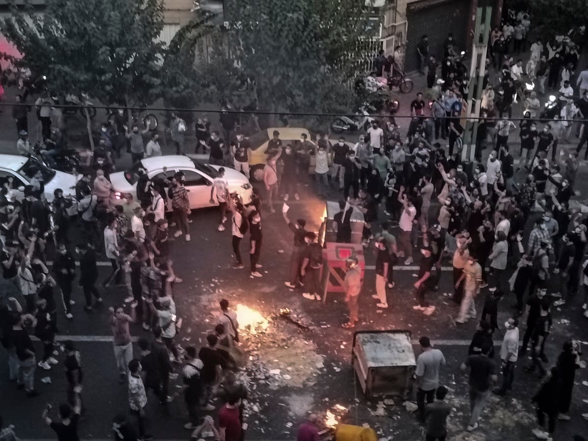 Iran sentences 8 to prison over paramilitary's death during last year's nationwide protests