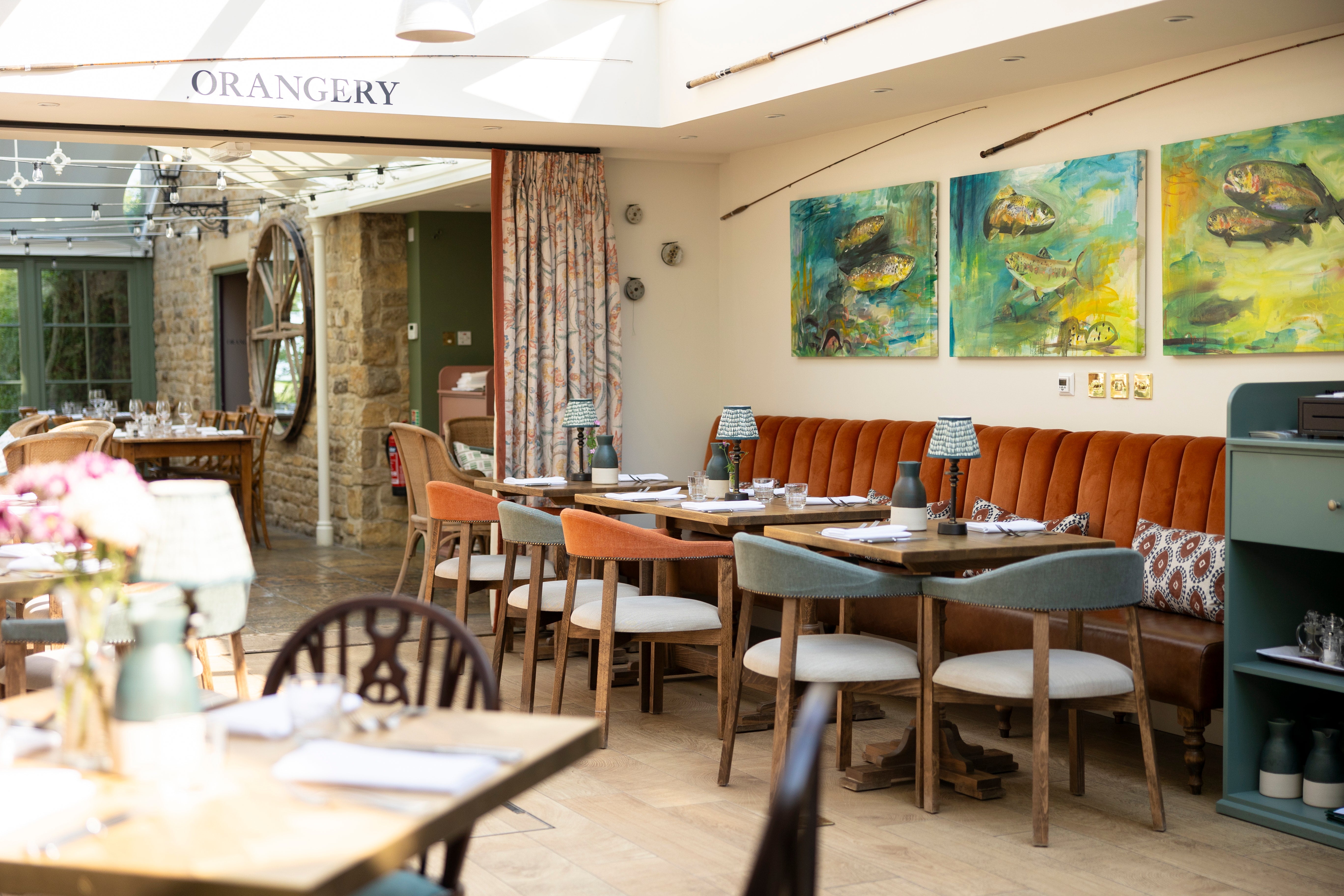 Diners settle in for a feast on fern-toned chairs