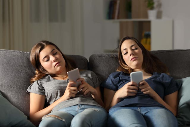 Too much time on the sofa or on their phones could be doing long term damage to teens’ hearts (Alamy/PA)