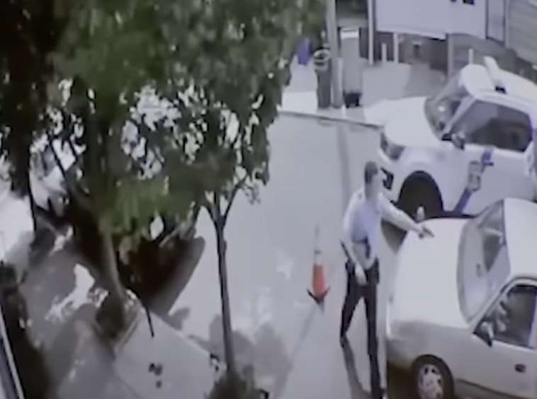 Surveillance footage shows Philadelphia police officer Mark Dial approach Eddie Irizarry’s car before opening fire